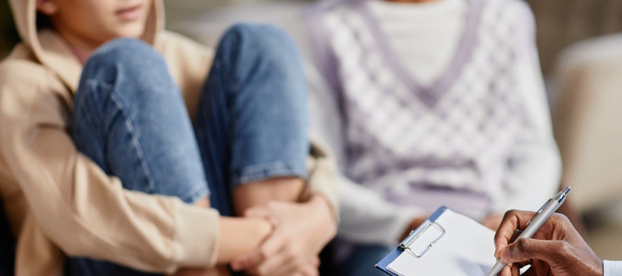 girls in chair holding her legs