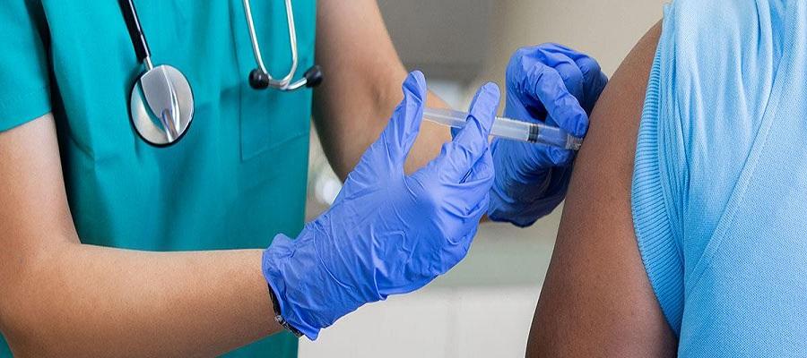 Black person receiving vaccination in arm