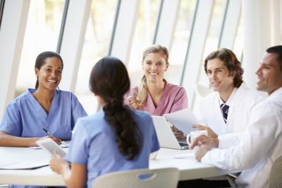 Nurses Collaborating at Table