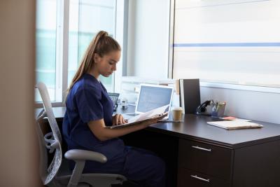 Nurse studying on computer